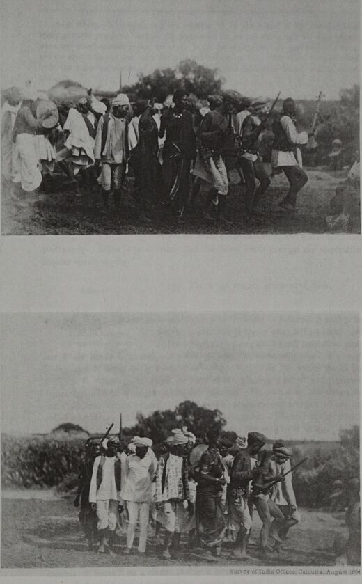 Two photographs, one above the other, each of a line of men in white moving together across open ground, holding on to one another as they tread.