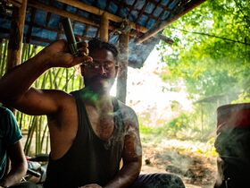 Bengali man smoking a chillum
