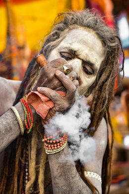 Sadhu smoking a clay chilam